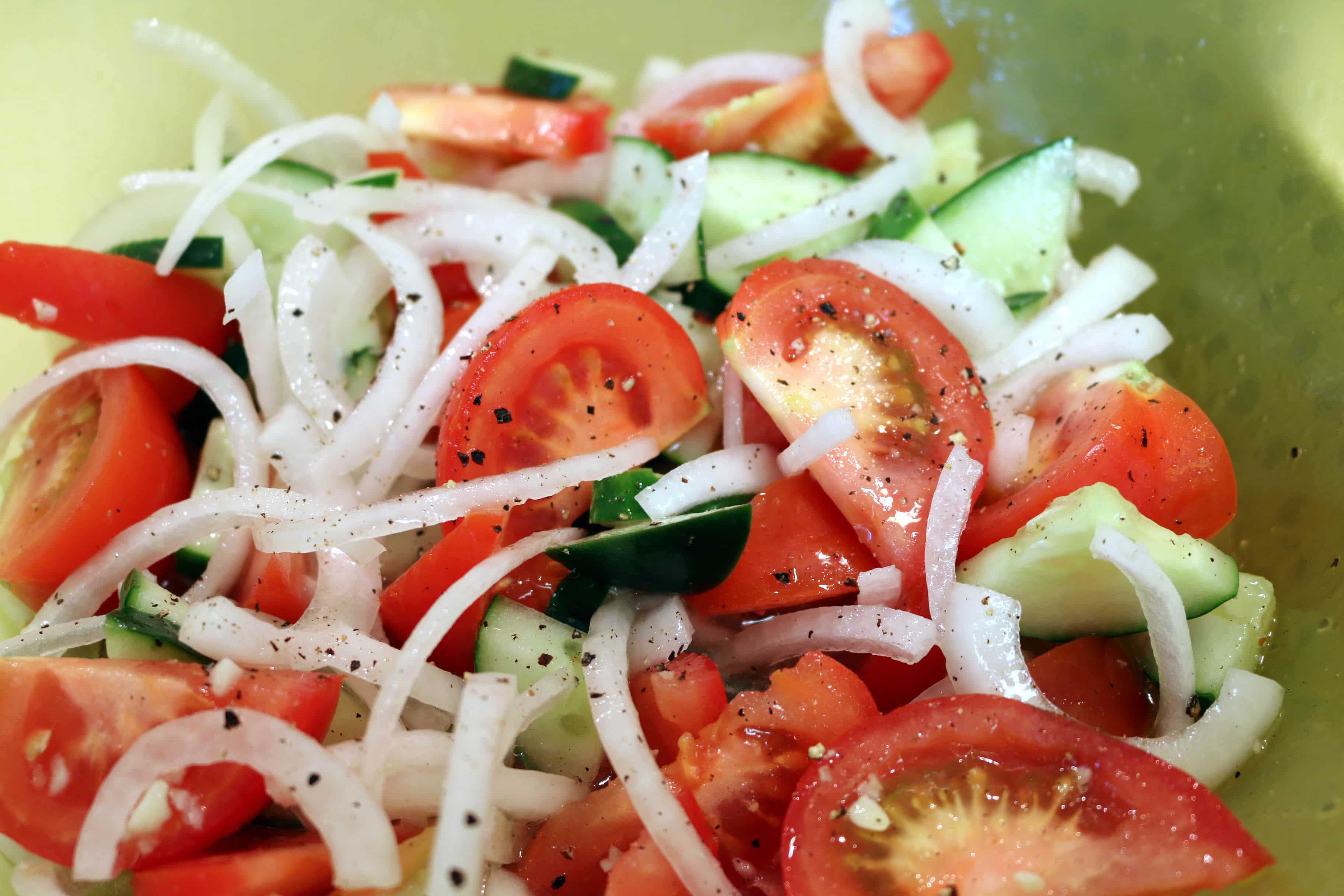 Marinated tomatoes, white onions, and cucumbers.